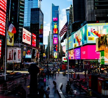 group of people walking near high-rise buildings