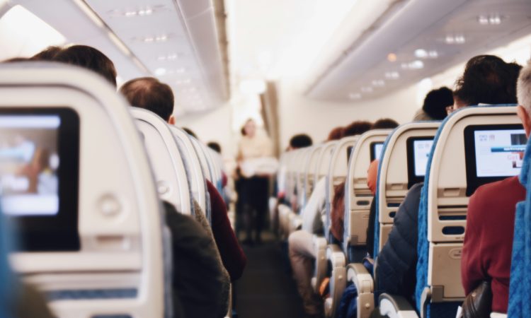 shallow focus photography of people inside of passenger plane